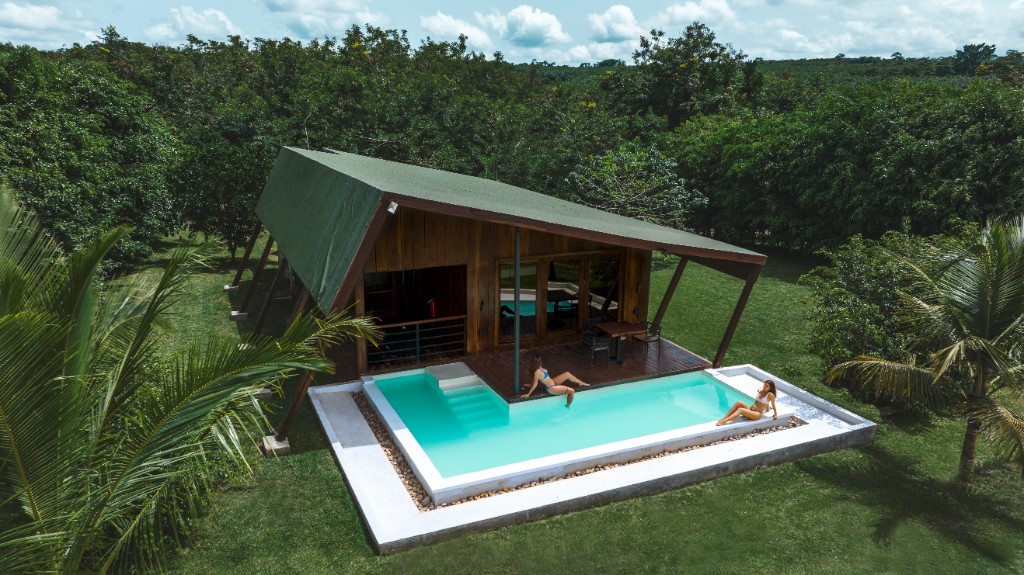 Aerial view of a cabin with pool