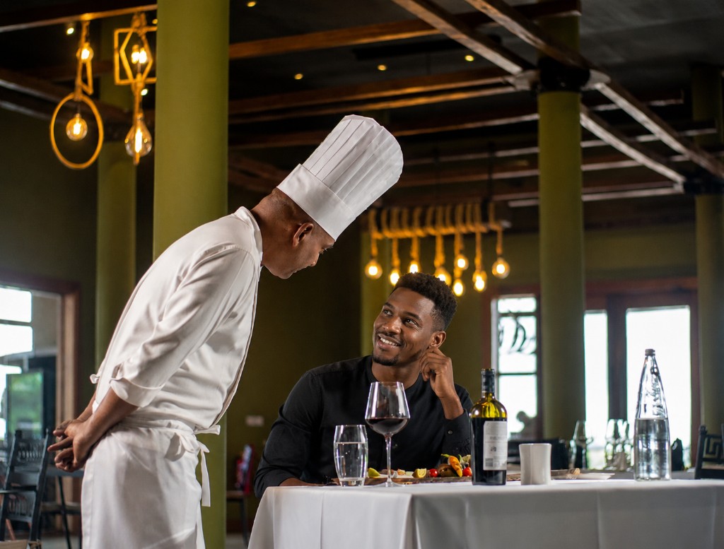 Chef speaking with a guest at Ceiba Restaurant